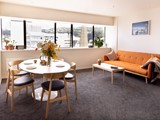 Living room and kitchen - Te Kainga apartment